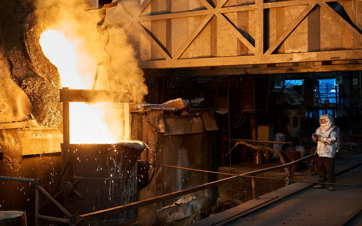 Molten steel poured from a ladle during mill liner casting at the foundry