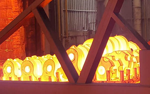 Mill liner castings glowing hot during heat treatment
