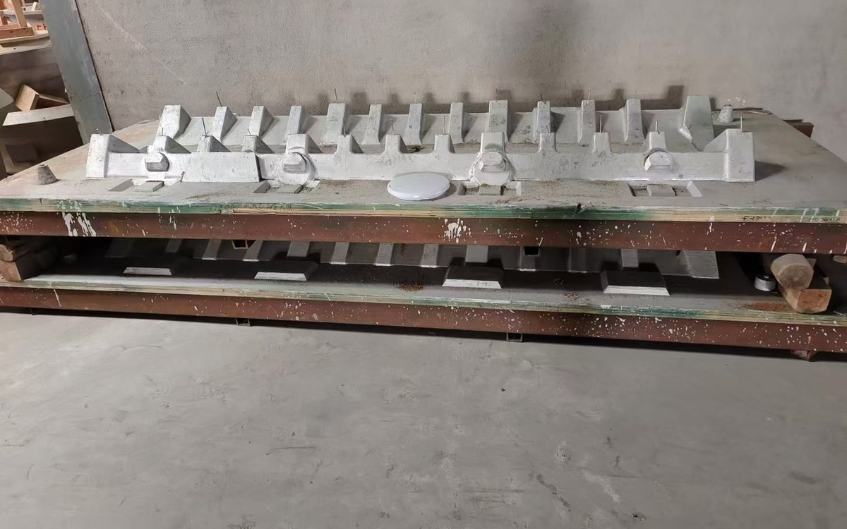 Wooden patterns for mill liner castings laid out on moulding boards in the pattern shop
